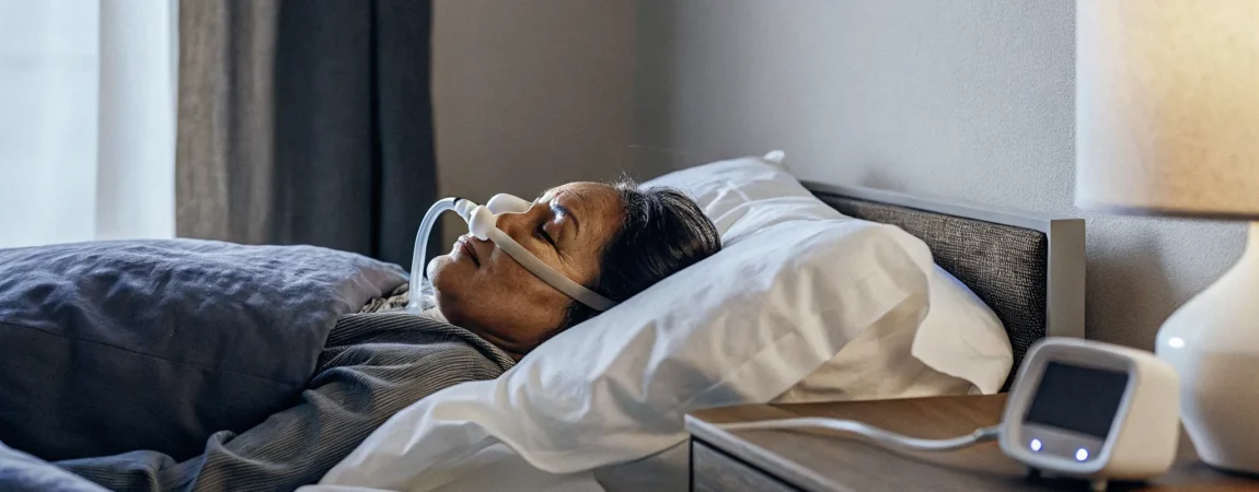 Patient sleeping peacefully with custom oral appliance therapy for sleep apnea